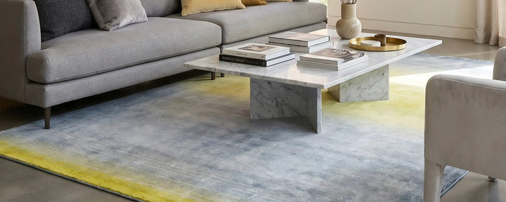 Geel en blauw vloerkleed op de homepagina van vloerkledenactie.nl om te verwijzen naar onze moderne vloerkleden