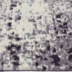 Zijkant detail aanzicht van het vloerkleed AZON in de kleur Grijs, gemaakt van Katoen.