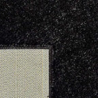 Achterkant hoek aanzicht van het vloerkleed BRAVON in de kleur Antraciet, gemaakt van Polyester.