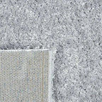 Achterkant hoek aanzicht van het vloerkleed BRAVON in de kleur Grijs, gemaakt van Polyester.