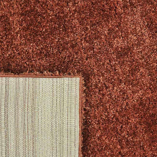 Achterkant hoek aanzicht van het vloerkleed BRAVON in de kleur Koper, gemaakt van Polyester.