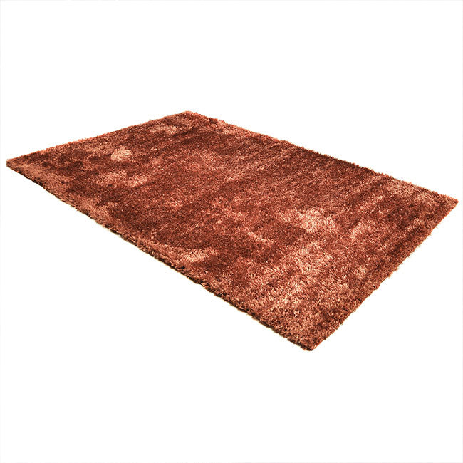 Diagonaal aanzicht van het vloerkleed BRAVON in de kleur Koper, gemaakt van Polyester.