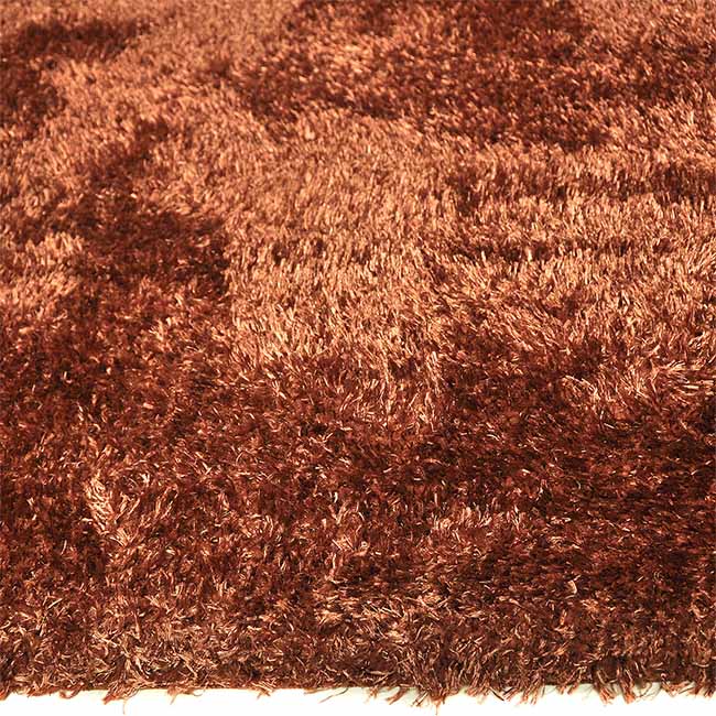 Zijkant detail aanzicht van het vloerkleed BRAVON in de kleur Koper, gemaakt van Polyester.