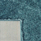 Achterkant hoek aanzicht van het vloerkleed BRAVON in de kleur Licht Blauw, gemaakt van Polyester.