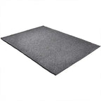 Diagonaal aanzicht van het vloerkleed BRISETTE in de kleur Donker Grijs, gemaakt van 100% Wol.