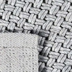 Achterkant hoek aanzicht van het vloerkleed BRISETTE in de kleur Zilver, gemaakt van 100% Wol.
