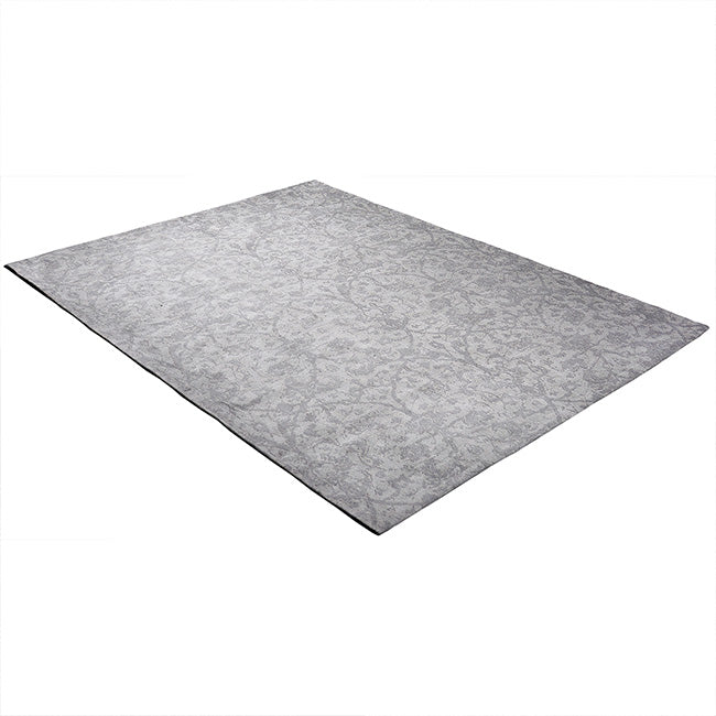 Diagonaal aanzicht van het vloerkleed CAVARA in de kleur Grijs, gemaakt van Katoen.