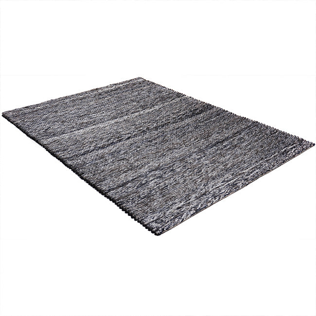 Diagonaal aanzicht van het vloerkleed CRELON in de kleur Bruin, gemaakt van 100% Wol.