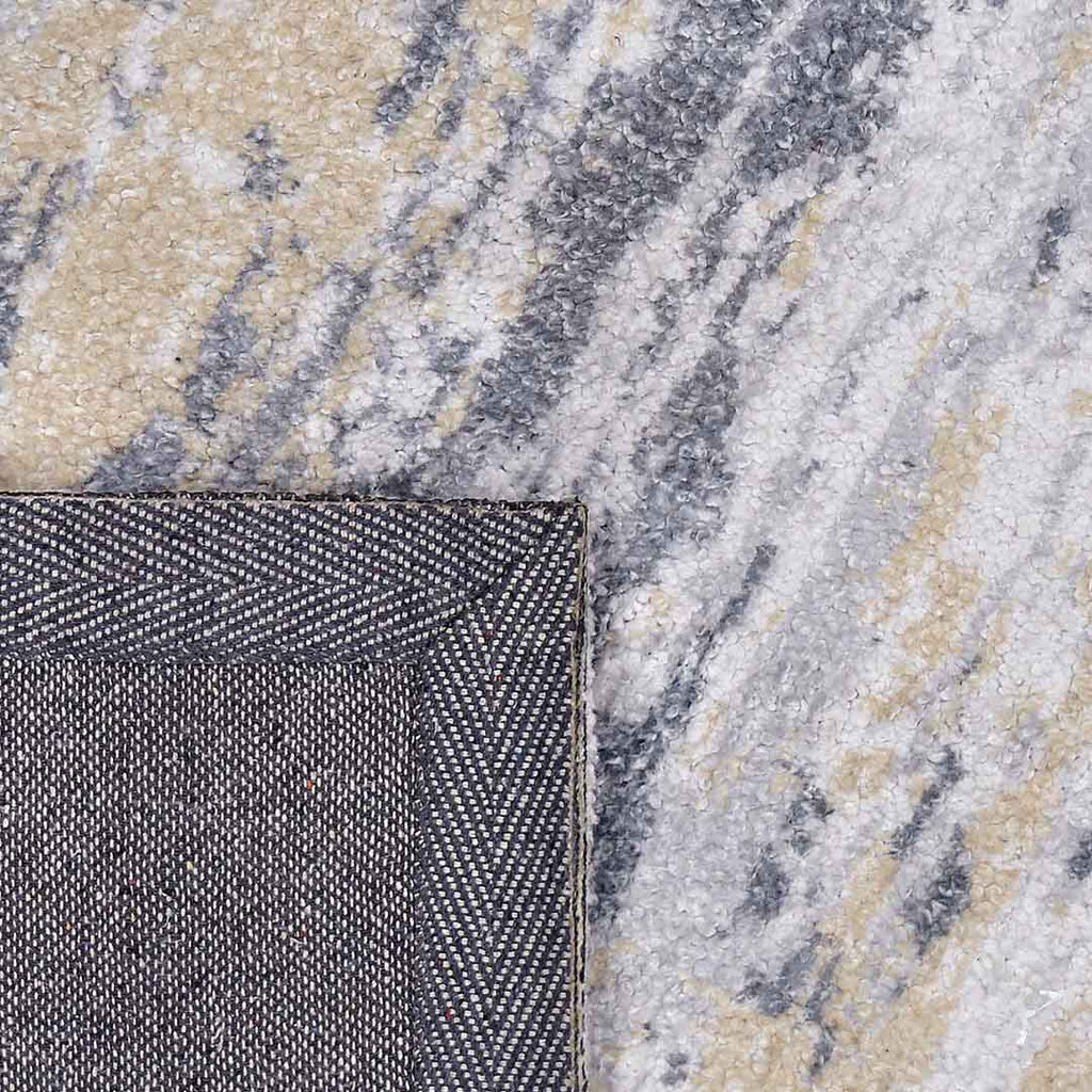 Achterkant hoek aanzicht van het vloerkleed CYLOR in de kleuren Goud / Grijs, gemaakt van Polyester.