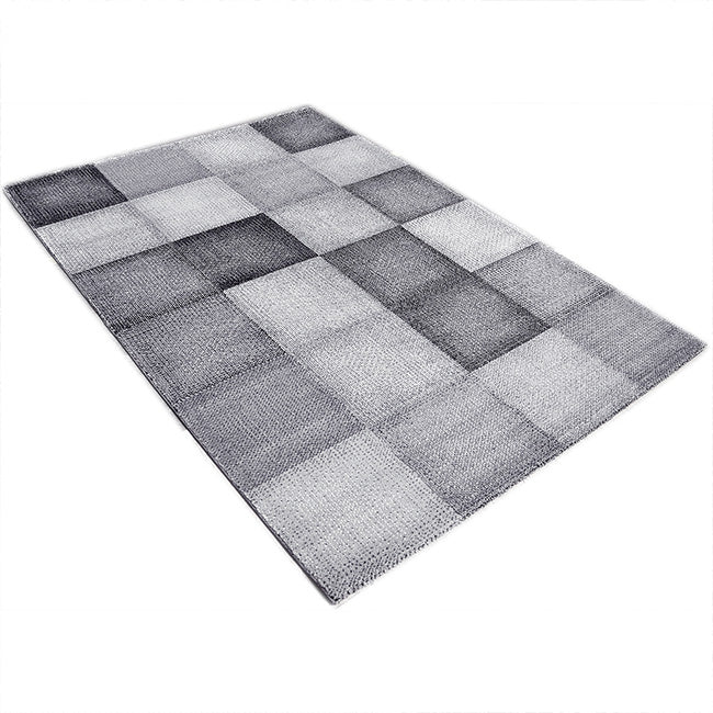 Diagonaal aanzicht van het vloerkleed DAKREN in de kleur Grijs, gemaakt van Polyester.