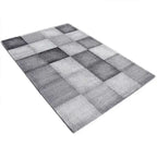 Diagonaal aanzicht van het vloerkleed DAKREN in de kleur Grijs, gemaakt van Polyester.