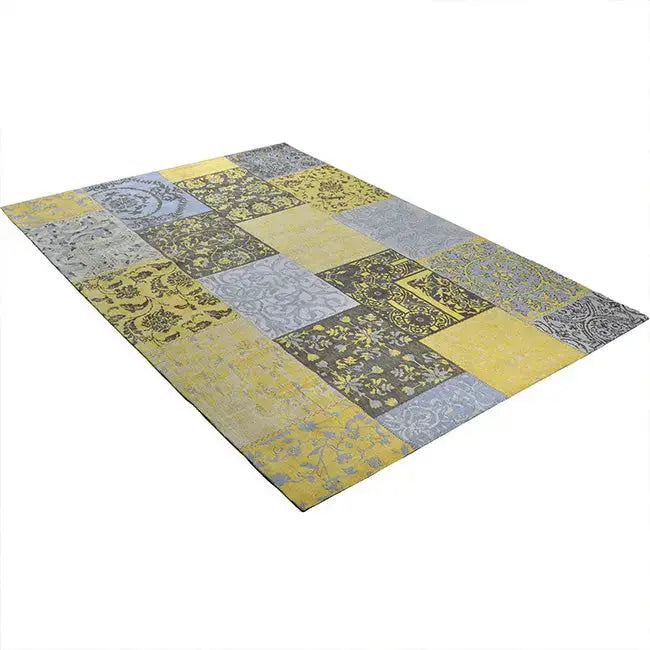 Diagonaal aanzicht van het vloerkleed DARIEN in de kleuren Geel / Grijs, gemaakt van Katoen.