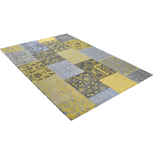 Diagonaal aanzicht van het vloerkleed DARIEN in de kleuren Geel / Grijs, gemaakt van Katoen.