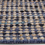 Zijkant detail aanzicht van het vloerkleed DENVAR in de kleur Grijs, gemaakt van Jute.