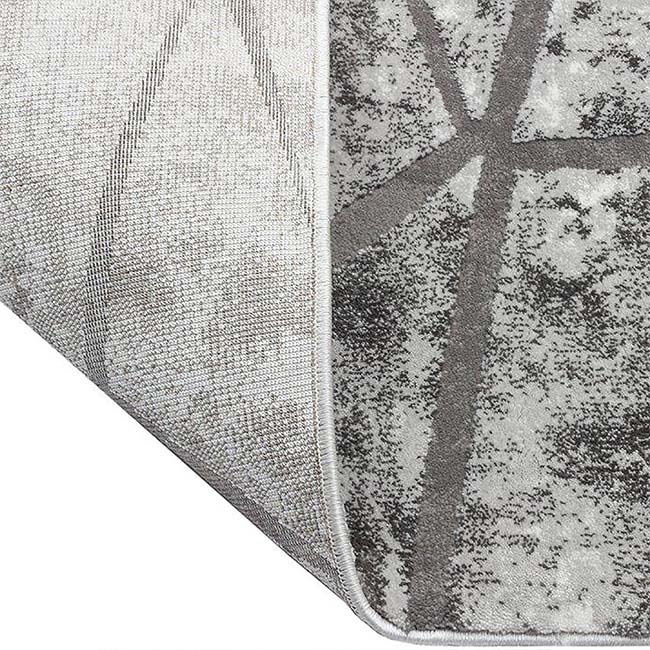 Achterkant hoek aanzicht van het vloerkleed DRAVEN in de kleur Grijs, gemaakt van Polyester.