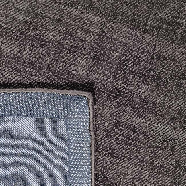 Achterkant hoek aanzicht van het vloerkleed DURELLE in de kleur Donker Grijs, gemaakt van Polyester.