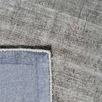 Achterkant hoek aanzicht van het vloerkleed DURELLE in de kleur Zilver, gemaakt van Polyester.