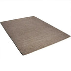 Diagonaal aanzicht van het vloerkleed EON SHADE in de kleuren Camel / Bruin, gemaakt van 100% Wol.