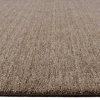 Zijkant detail aanzicht van het vloerkleed EON SHADE in de kleuren Camel / Bruin, gemaakt van 100% Wol.