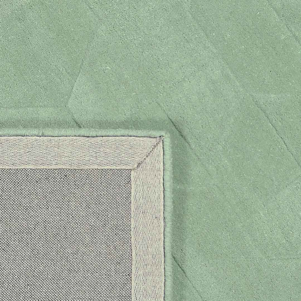Achterkant hoek aanzicht van het vloerkleed GARON HEXAGON in de kleuren Mint / Groen, gemaakt van 100% Wol.