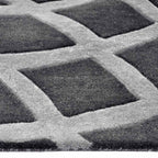 Zijkant detail aanzicht van het vloerkleed GARON INCA in de kleur Grijs, gemaakt van 100% Wol.