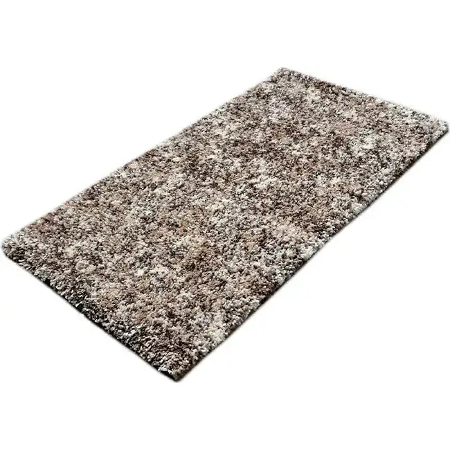 Diagonaal aanzicht van het vloerkleed HALVOR Klein in de kleur Beige, gemaakt van Polyester.