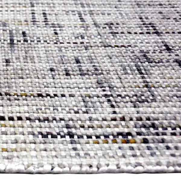 Zijkant detail aanzicht van het vloerkleed HARLEN in de kleur Beige, gemaakt van Wol en Polyester mix.