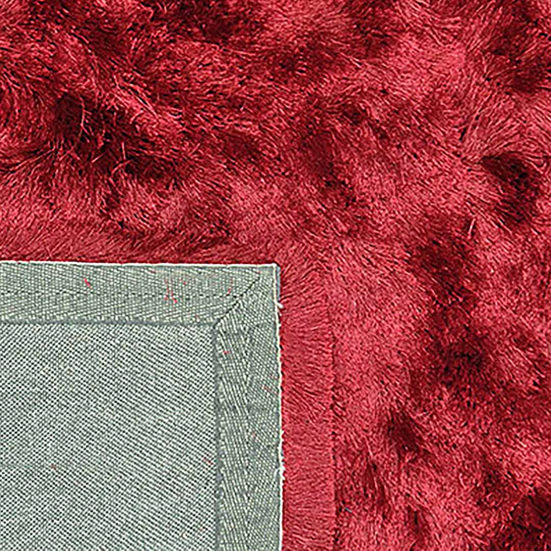 Achterkant hoek aanzicht van het vloerkleed INDIRA in de kleur Rood, gemaakt van Polyester.
