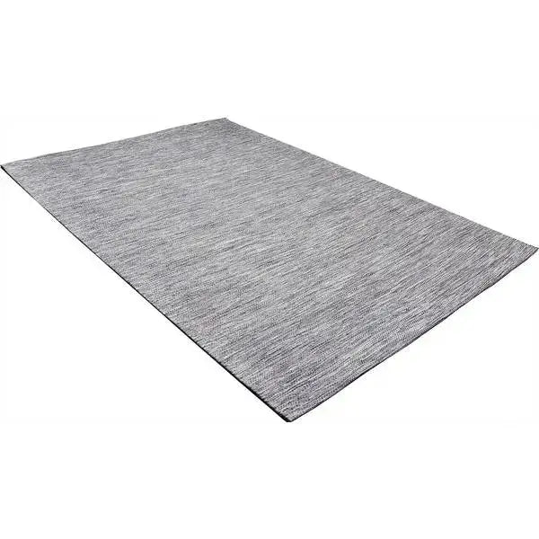 Diagonaal aanzicht van het vloerkleed LYDEN in de kleur Grijs, gemaakt van Katoen.