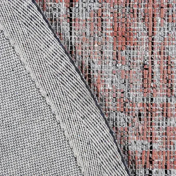 Achterkant hoek aanzicht van het vloerkleed MAREK Rond in de kleuren Zalm / Roze, gemaakt van Polyester en Nylon mix.
