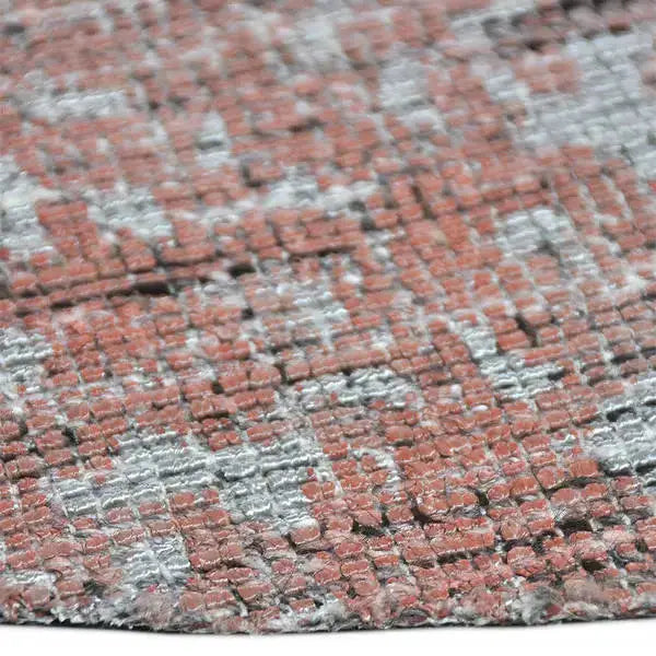 Zijkant detail aanzicht van het vloerkleed MAREK Rond in de kleuren Zalm / Roze, gemaakt van Polyester en Nylon mix.