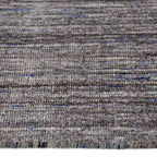 Zijkant detail aanzicht van het vloerkleed MARVELL in de kleur Bruin, gemaakt van Wol mix.