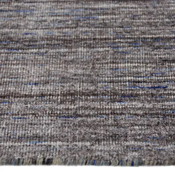 Zijkant detail aanzicht van het vloerkleed MARVELL in de kleur Bruin, gemaakt van Wol mix.