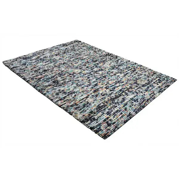 Diagonaal aanzicht van het vloerkleed MIRANDE in de kleur Multikleurig, gemaakt van 100% Wol.