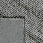 Achterkant hoek aanzicht van het vloerkleed MORDANA in de kleur Bruin, gemaakt van Wol en Polyester mix.