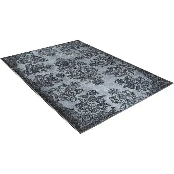Diagonaal aanzicht van het vloerkleed NEXON in de kleur Grijs, gemaakt van Polyester.