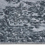Zijkant detail aanzicht van het vloerkleed NEXON in de kleur Grijs, gemaakt van Polyester.