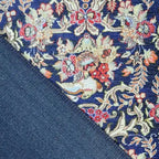 Achterkant hoek aanzicht van het vloerkleed NEXON kirman in de kleuren Blauw / Rood, gemaakt van Polyester.