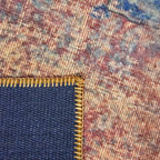 Achterkant hoek aanzicht van het vloerkleed NEXON konya in de kleuren Rood / Oranje / Blauw, gemaakt van Polyester.