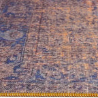 Zijkant detail aanzicht van het vloerkleed NEXON konya in de kleuren Rood / Oranje / Blauw, gemaakt van Polyester.