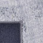 Achterkant hoek aanzicht van het vloerkleed NEXON patch in de kleur Grijs, gemaakt van Polyester.