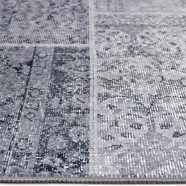 Zijkant detail aanzicht van het vloerkleed NEXON patch in de kleur Grijs, gemaakt van Polyester.