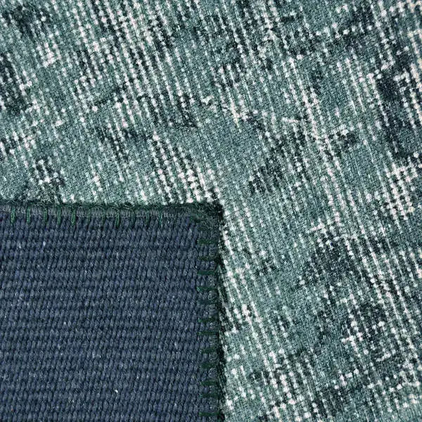 Achterkant hoek aanzicht van het vloerkleed NEXON patch in de kleur Groen, gemaakt van Polyester.