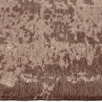 Zijkant detail aanzicht van het vloerkleed RYNDEN in de kleur Bruin, gemaakt van Katoen.