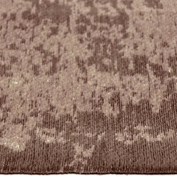 Zijkant detail aanzicht van het vloerkleed RYNDEN in de kleur Bruin, gemaakt van Katoen.