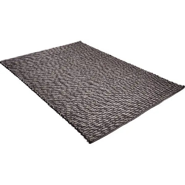 Diagonaal aanzicht van het vloerkleed SOREN in de kleuren Grijs / Mix, gemaakt van Wol mix.