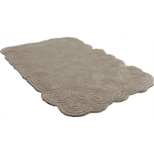 Diagonaal aanzicht van het vloerkleed SYLON in de kleur Beige, gemaakt van 100% Wol.