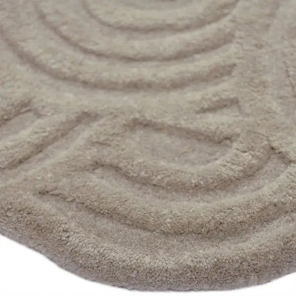 Zijkant detail aanzicht van het vloerkleed SYLON in de kleur Beige, gemaakt van 100% Wol.