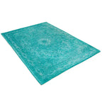 Diagonaal aanzicht van het vloerkleed TALMAR in de kleuren Aqua / Blauw, gemaakt van Katoen.