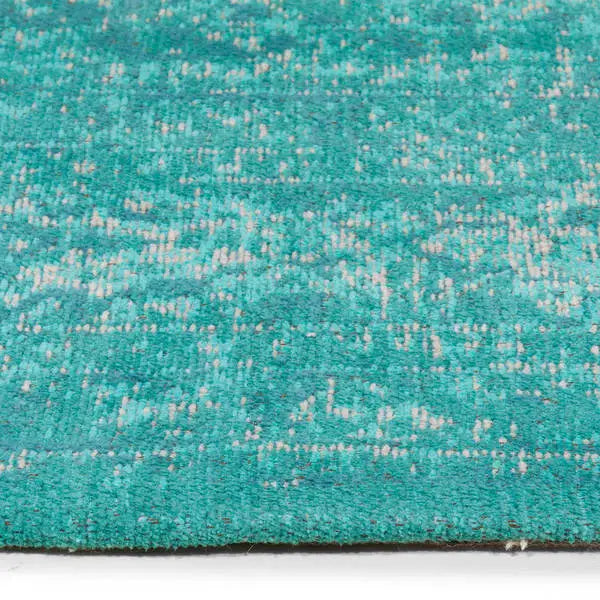 Zijkant detail aanzicht van het vloerkleed TALMAR in de kleuren Aqua / Blauw, gemaakt van Katoen.